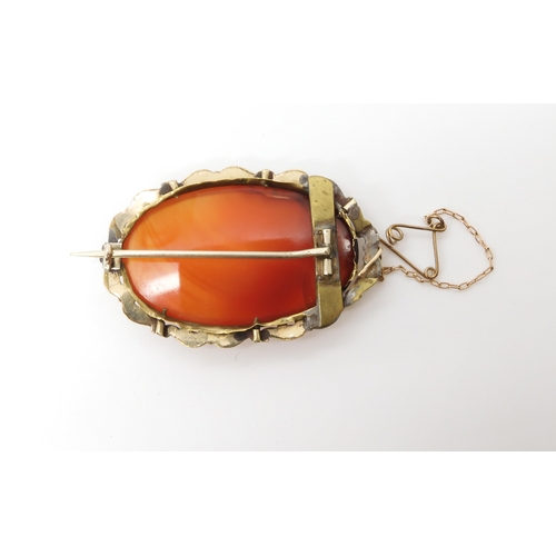 588 - A rolled gold carnelian brooch, weight 13.7gms