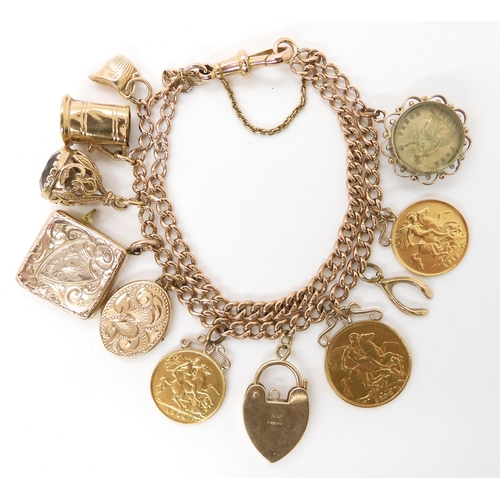 592 - A 9ct gold charm bracelet made from a tapered fob chain, hung with a 1898 gold full sovereign, a 190... 