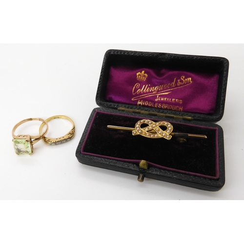 600 - A 15ct gold pearl set knot brooch weight 2.9gms, an 18ct gold five stone diamond ring, (af) weight 2... 