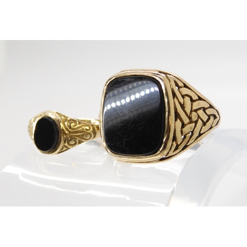 603 - A 9ct gold gents onyx ring with knotwork shoulders, size Z, and a smaller example size O1/2, weight ... 