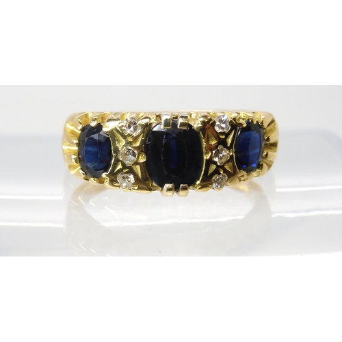 613 - An 18ct gold sapphire and diamond ring, size Q, weight 6.4gms