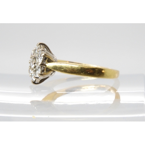 614 - An 18ct gold diamond flower ring set with estimated approx 0.70cts of brilliant cut diamonds, finger... 