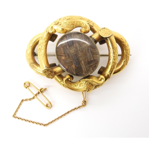 615 - A Victorian rolled gold hair panel mourning brooch, dimensions 5cm x 3.5cm, weight 16.1gms