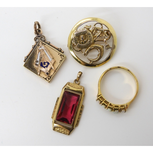 617 - A collection of gold plated items to include a Masonic pendant, a red gem set Deco pendant and other... 