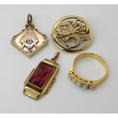 617 - A collection of gold plated items to include a Masonic pendant, a red gem set Deco pendant and other... 