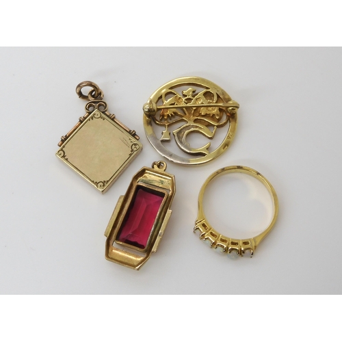 617 - A collection of gold plated items to include a Masonic pendant, a red gem set Deco pendant and other... 