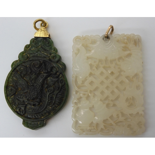 619 - Two Chinese hardstone carved pendants with yellow metal mounts