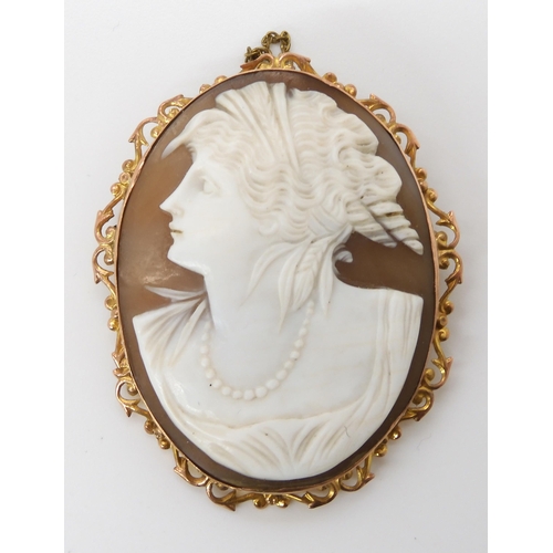 620 - A 9ct mounted large shell cameo, dimensions in mount 5.6cm x 4.5cm, weight 13.1gms