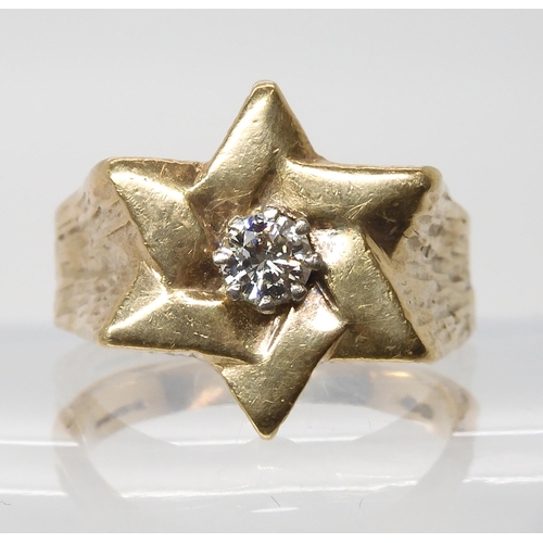 630 - A Star shaped gents ring set with an estimated approx 0.40ct brilliant cut diamond, finger size Y1/2... 