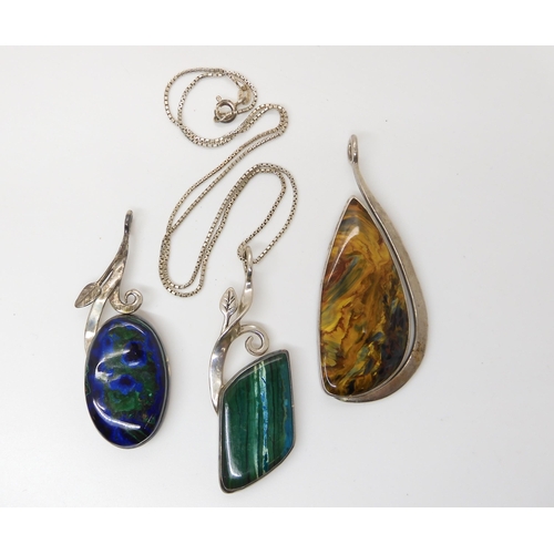 638 - Three American designer pendants made by Tom Burns of Vermont, all three signed, to include blue and... 