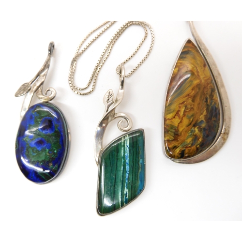 638 - Three American designer pendants made by Tom Burns of Vermont, all three signed, to include blue and... 