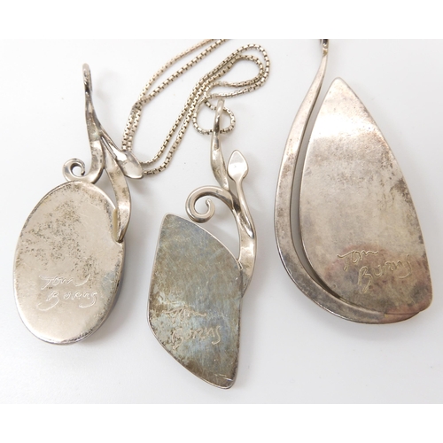 638 - Three American designer pendants made by Tom Burns of Vermont, all three signed, to include blue and... 