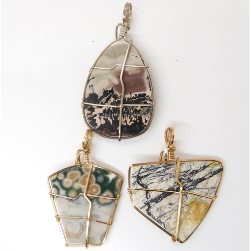 639 - Three American silver and gold plated wire wrapped mineral pendants to include marine jasper, and tw... 