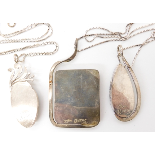 640 - Three American designer pendants made by Tom Burns, all three signed to include tiger's eye, marine ... 