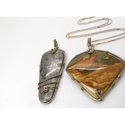 643 - Three American silver and gold plated wire wrapped mineral pendants to include pyrites, fossilized c... 