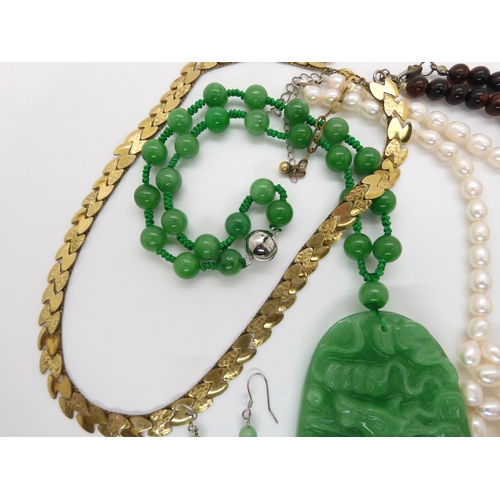 650 - Chinese green hardstone pendant and earrings, cultured pearls and other items in a mother of pearl b... 