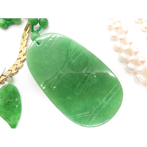 650 - Chinese green hardstone pendant and earrings, cultured pearls and other items in a mother of pearl b... 