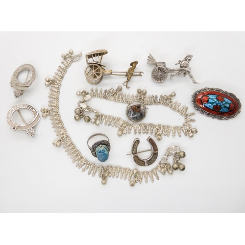 658 - Two white metal Rickshaw brooches, a Scottish silver thistle brooch and other items