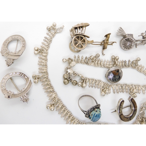 658 - Two white metal Rickshaw brooches, a Scottish silver thistle brooch and other items