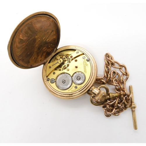 667 - A gold plated Everite pocket watch with a gold plated T&H fob chain