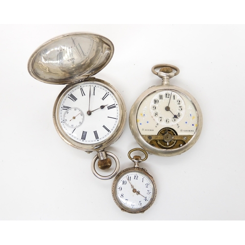 673 - Two continental silver cased pocket watches, and a further fob watch