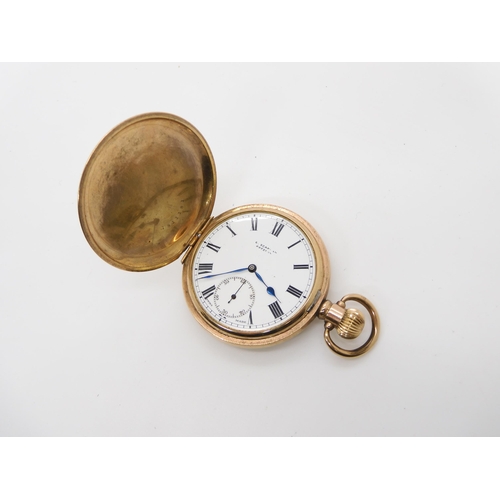 675 - A gold plated Swiss Visible pocket watch, and a boxed set of magnifying glass and paper knife