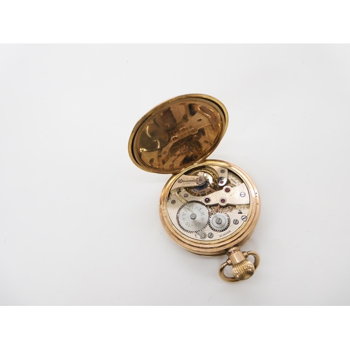 675 - A gold plated Swiss Visible pocket watch, and a boxed set of magnifying glass and paper knife