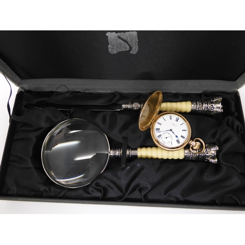 675 - A gold plated Swiss Visible pocket watch, and a boxed set of magnifying glass and paper knife