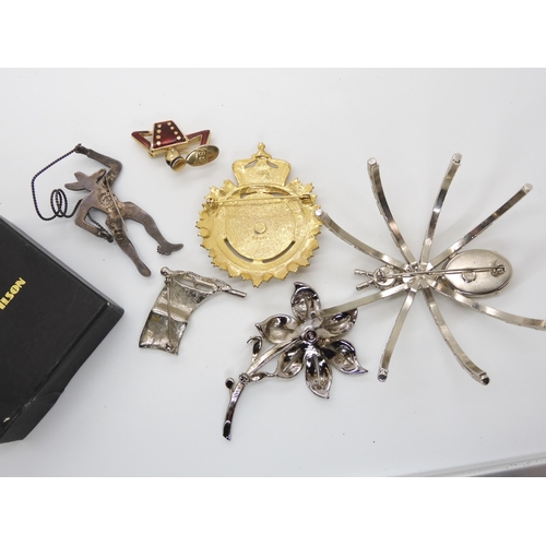 677 - A large Butler & Wilson spider brooch, together with three branded B&W brooches, a Mexican s... 