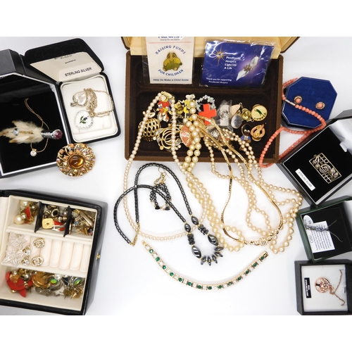 683 - A collection of vintage costume jewellery to include, a string of coral beads and earrings, a grouse... 