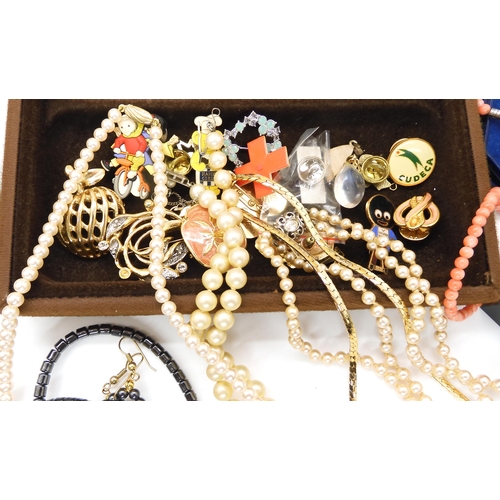 683 - A collection of vintage costume jewellery to include, a string of coral beads and earrings, a grouse... 