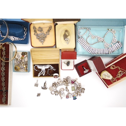 684 - An extensive silver charm bracelet, and a collection of silver and costume jewellery