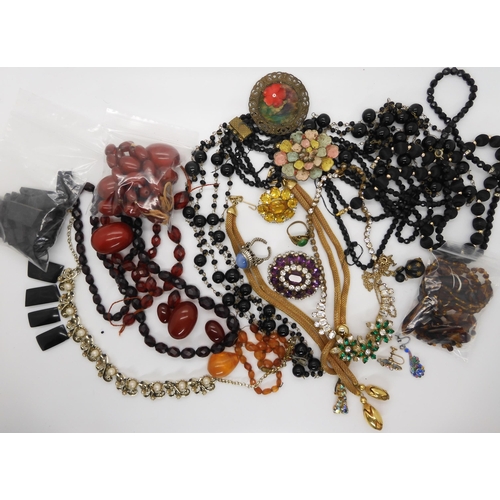 690 - A collection of cherry amber beads, weight approx 145.7gms, an engraved jet bracelet (both af) and a... 