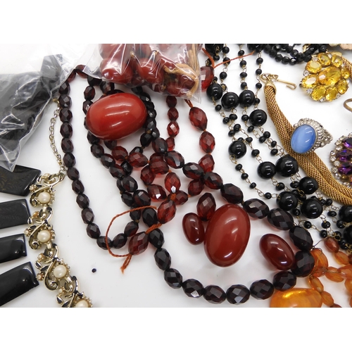 690 - A collection of cherry amber beads, weight approx 145.7gms, an engraved jet bracelet (both af) and a... 