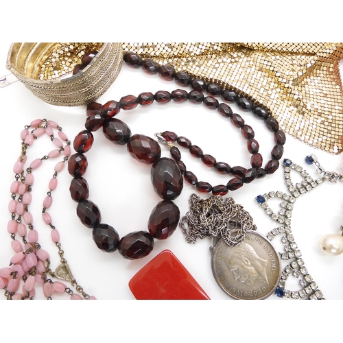 691 - A string of cherry amber beads, weight 62.5gms, a French black glass bead fob chain, good diamante, ... 