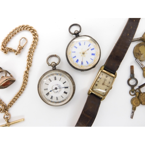 696 - Two continental silver small pocket watches with decorative dials, a collection of watch keys and an... 