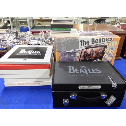 470 - A Beatles novelty compact disc player in the style of a suitcase record player together various comp... 