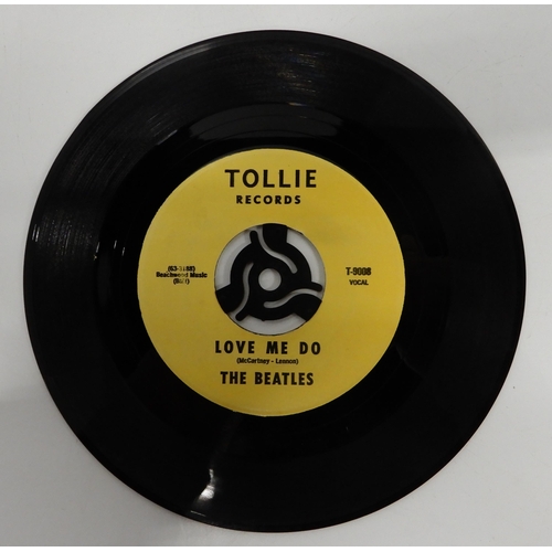 476 - A vinyl record copy of the Beatles hit single Love me Do (A-side) and P.S. I Love You (B-side) on To... 