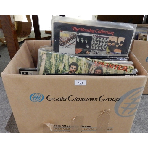 484 - A box of vinyl LP records with The Merseybeats, The Concert for Bangladesh, Tommy by The Who, Splint... 