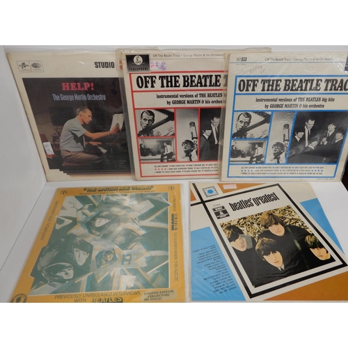 489 - A lot of The Beatles and related box set vinyl records and Ringo Starr vinyl LP records with The Bea... 