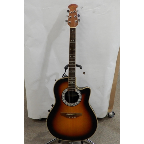 495 - An Ovation Celebrity CC57 electro acoustic guitar with a soft case capo etc