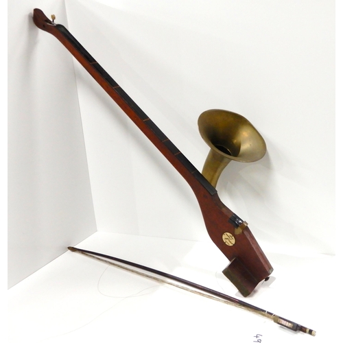 497 - A phonofiddle by A. T. Howson, London. Made of wood with curved brass horn with a flared bell attach... 