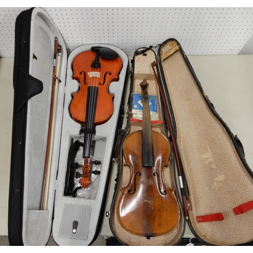 499 - A modern violin with bow and case together with a part violin with case and bow