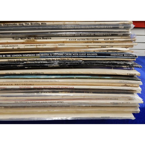 484 - A box of vinyl LP records with The Merseybeats, The Concert for Bangladesh, Tommy by The Who, Splint... 