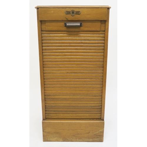 1 - An early 20th century oak tambour front filing cabinet, 92cm high x 45cm wide x 39cm