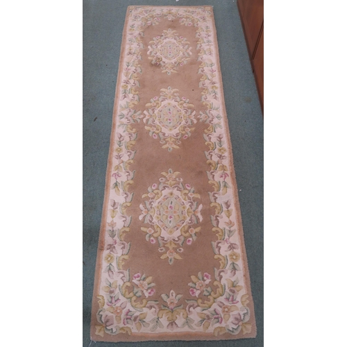 102 - A 20th century floral pattern runner, 233cm long x 70cm wide