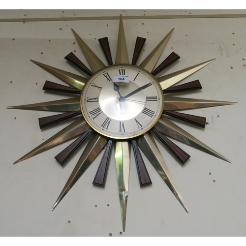 104 - A 20th century Metamex quartz sunburst clock, 60cm high x 59cm wide