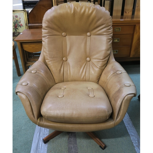 120 - A mid 20th century Schreiber swivel egg chair upholstered in tan buttoned vinyl, 97cm high x 87cm wi... 