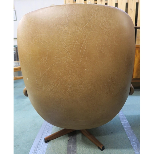 120 - A mid 20th century Schreiber swivel egg chair upholstered in tan buttoned vinyl, 97cm high x 87cm wi... 