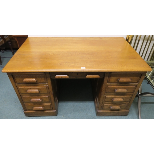 130 - An early 20th century oak pedestal desk, 77cm high x 136cm wide x 81cm deep